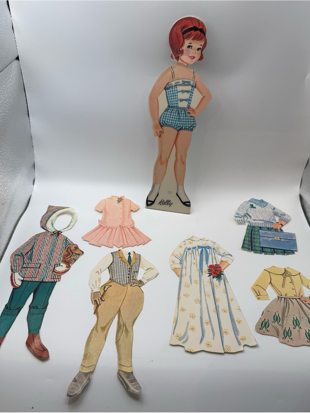 Vintage "Kelly" Paper Doll Cut-Out Set with 6 Outfits & Accessories Mid-
Century